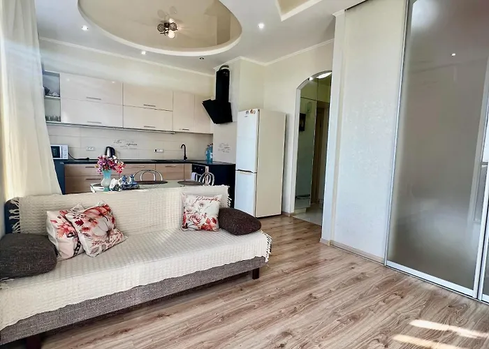 спальня-студия с видом на море и парк Апартаменти